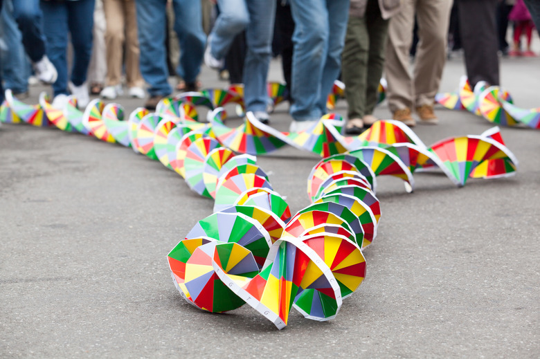 DNA model in focus, blurred crowd in background