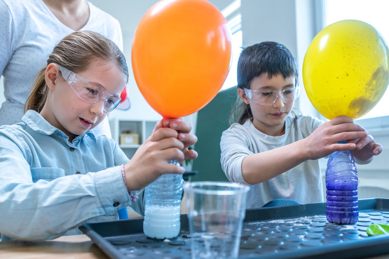 Students doing colour experiment in laboratory