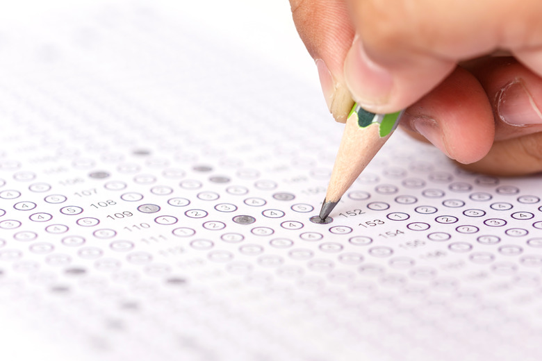 Close up hand with pencil on answer sheet