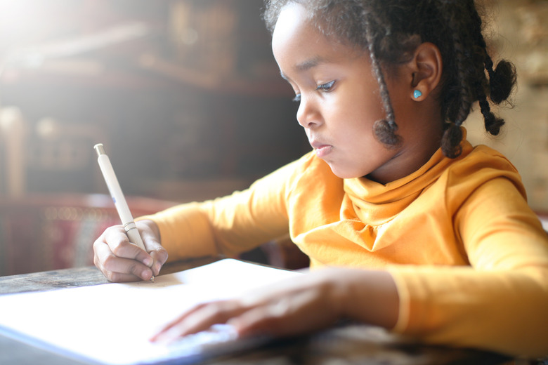 Little African girl writing.