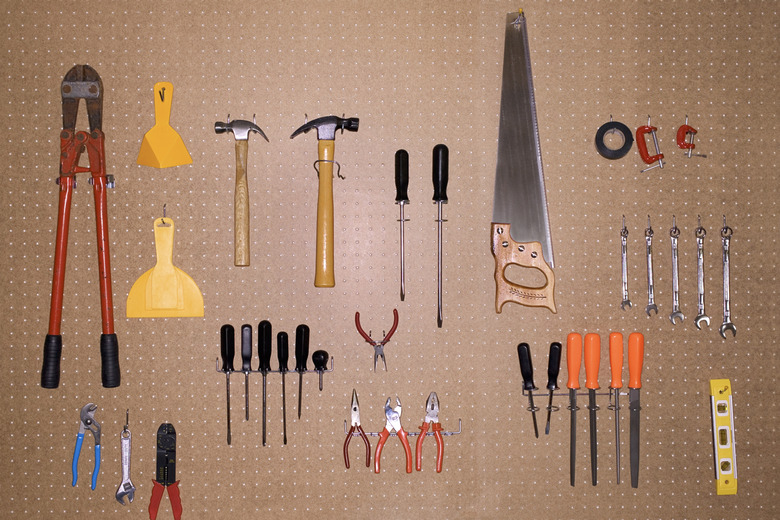 Tools hang neatly on pegboard in the garage.