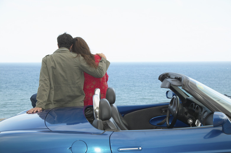 Mid-Adult Couple Looking at Sea from convertible