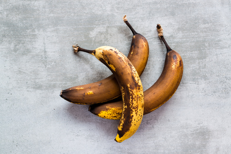 Brown bananas on a concrete table