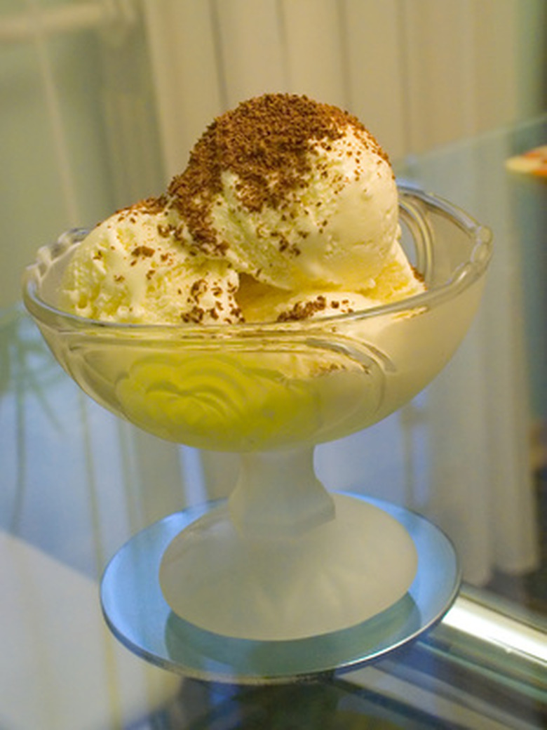 Three scoops of ice cream in a fancy glass dish