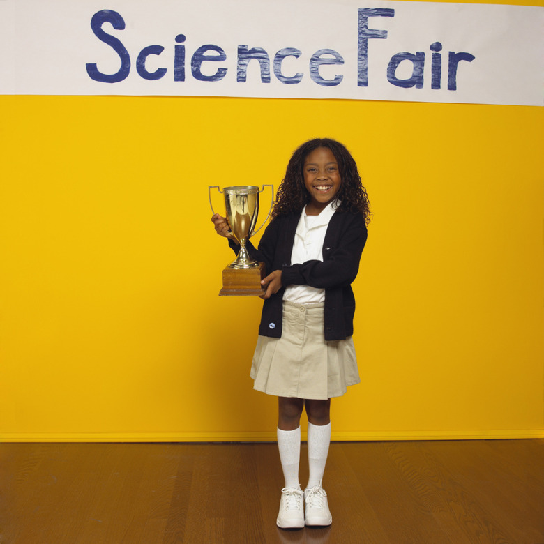 Science fair winner with trophy