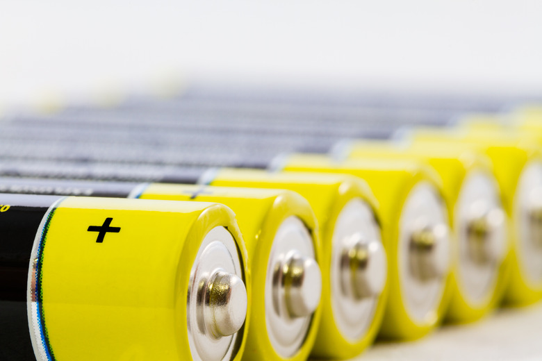 Yellow black AAA alkaline batteries isolated on white