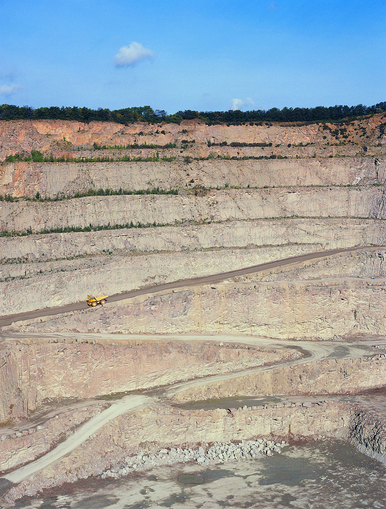 Road dropping into deep quarry