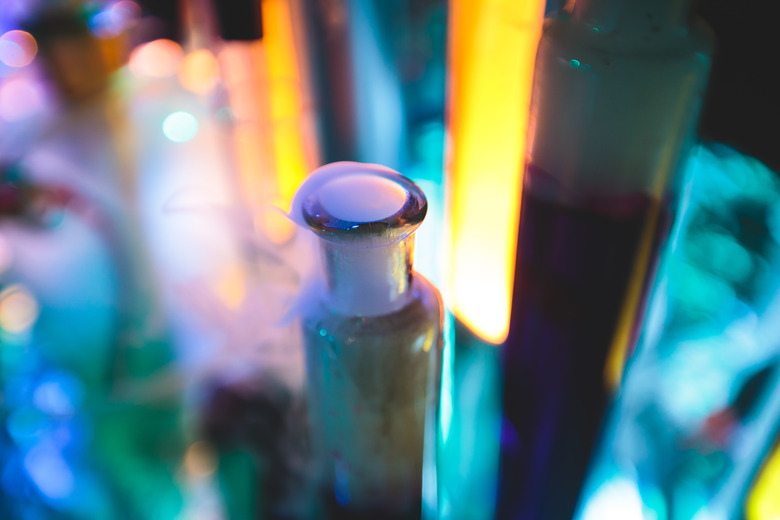 Different colored tubes and equipment during chemical experiment in laboratory