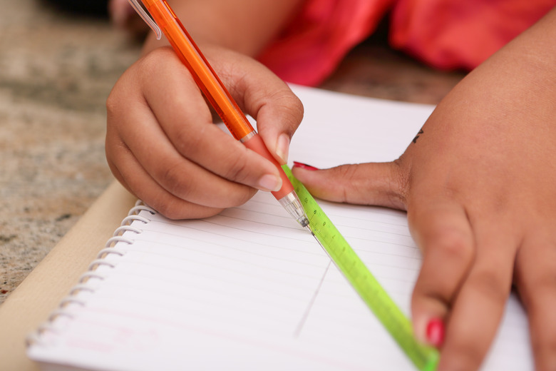 Indian little girl draw the lines with degree