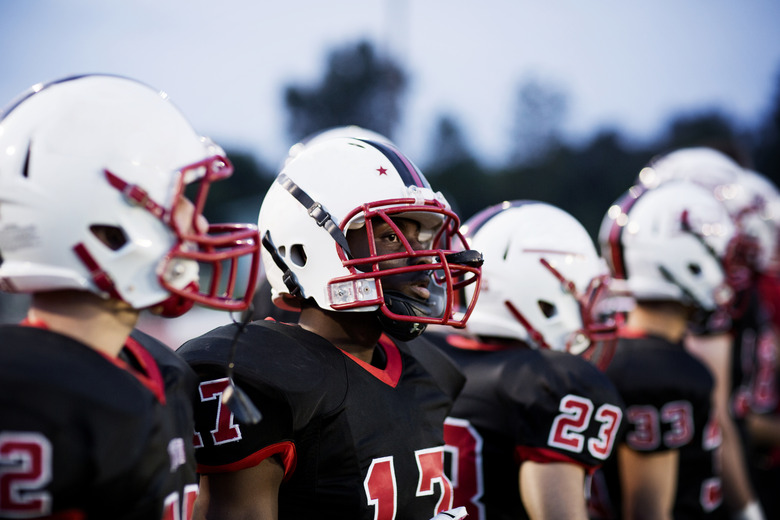 American football team with sports helmet on field