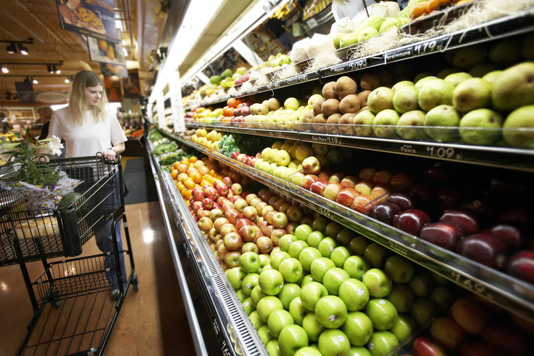 Young woman buying fruit in a supermarket