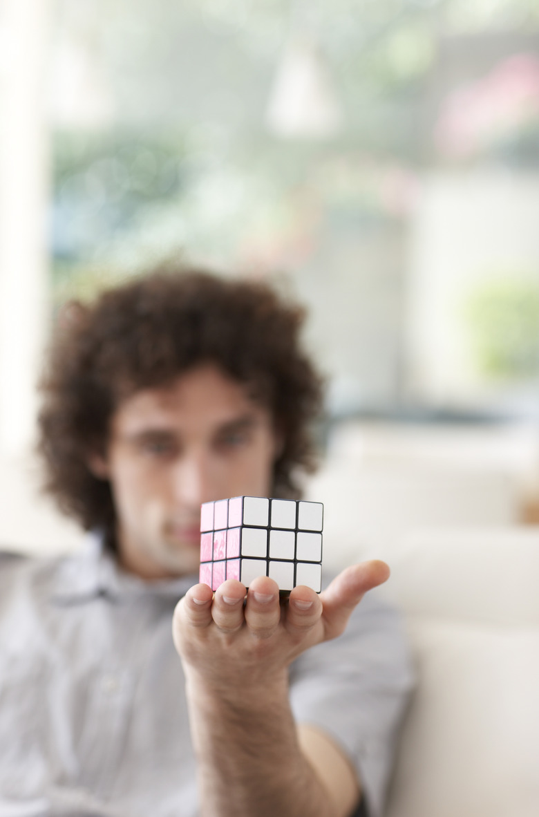 man holding out a Rubix Cube