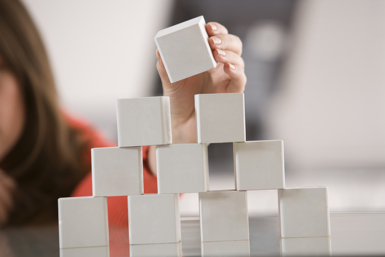 Woman stacking blocks