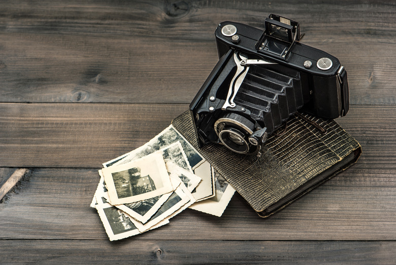 vintage camera and album with old photos