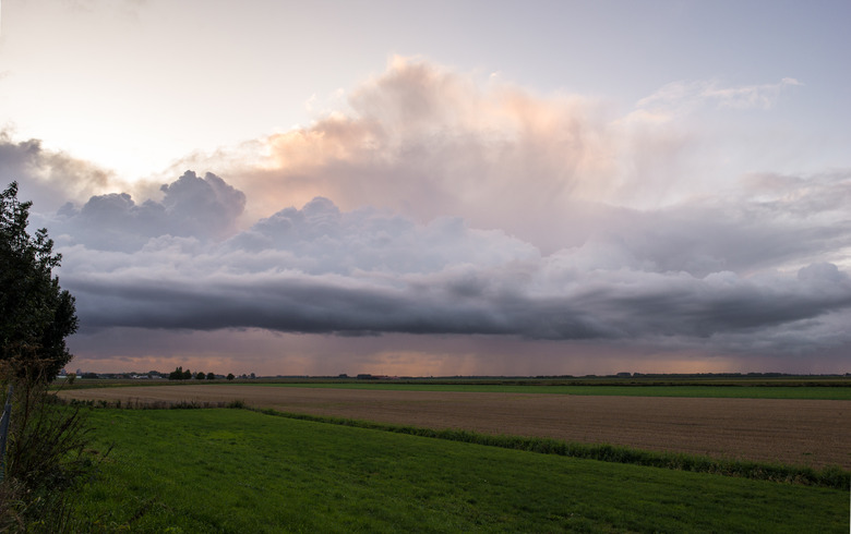 Beautiful Landscape Image of Storm Clouds over a Wide Open Flat Landscape