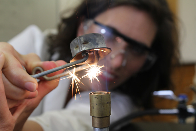 Biology teacher using Bunsen Burner