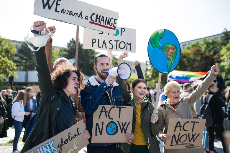 People with placards and amplifier on global strike for climate change.