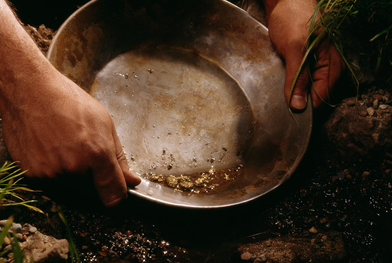 Person panning for gold