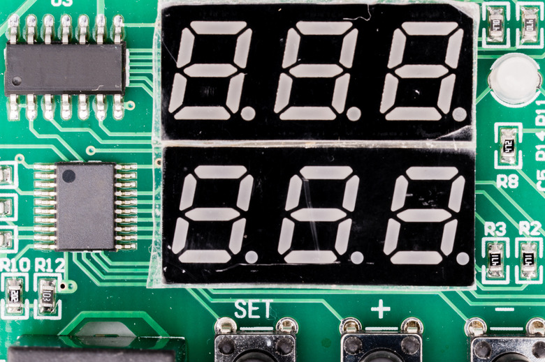 Seven-segment display (SSD), or indicator, electronic display device for displaying decimal numerals. On green pcb with controller.