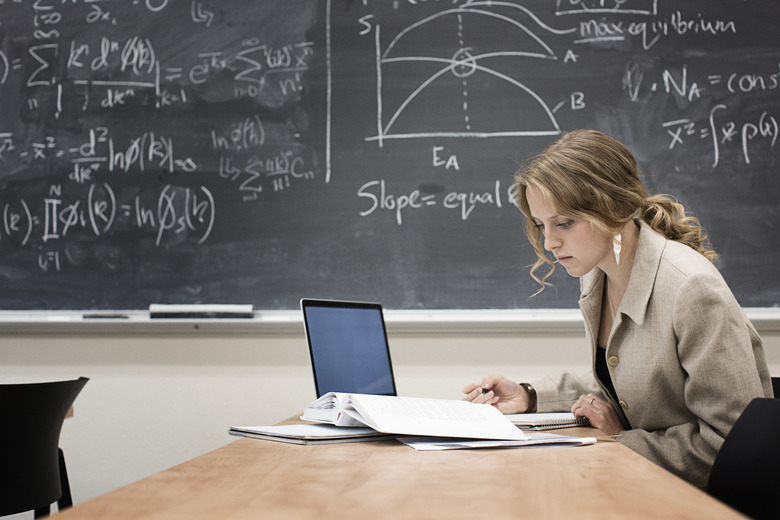 Caucasian student working in classroom