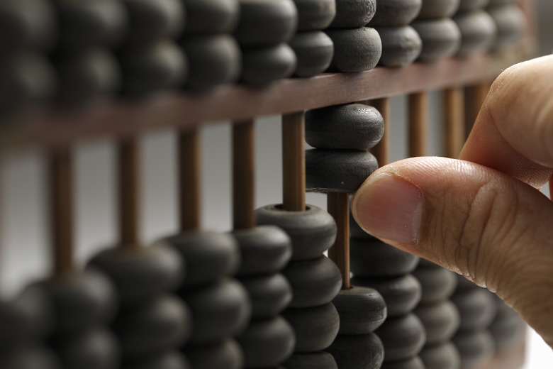 Man hands are operating abacus