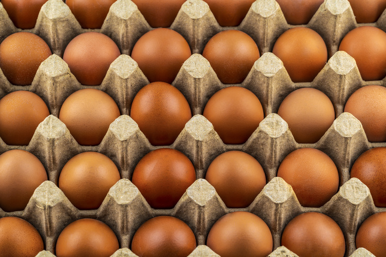 Brown eggs on an egg tray