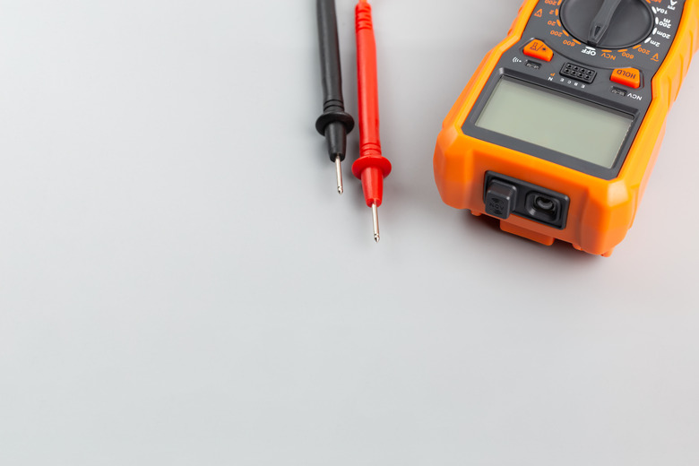 close-up view of digital electrical multimeter with probe tips