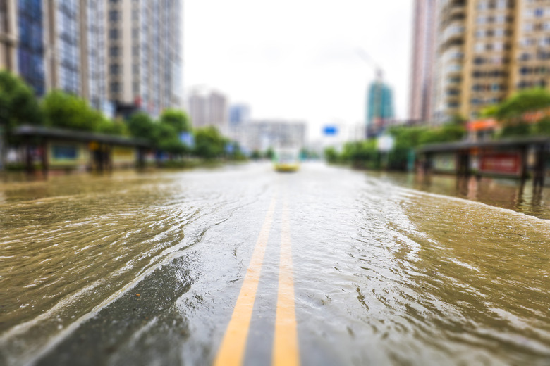 Streets inundated by heavy rain in the city. The background of urban construction and management.