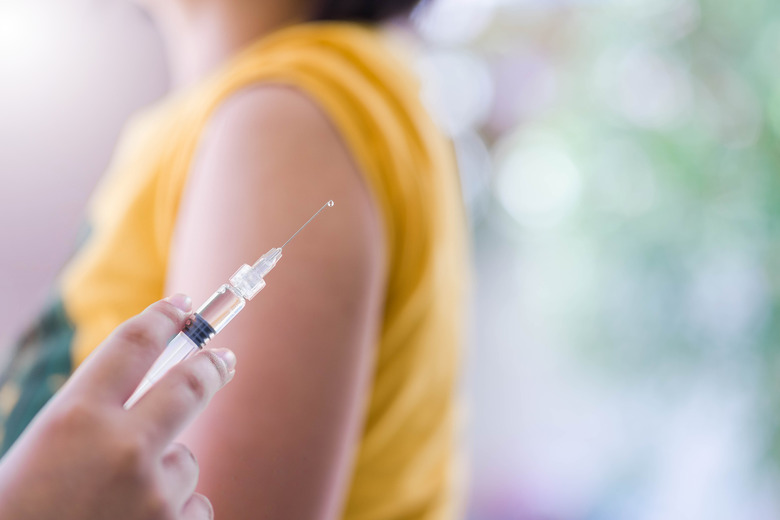 Closeup of doctor hand are vaccinations to patients using the syringe.Medical concept