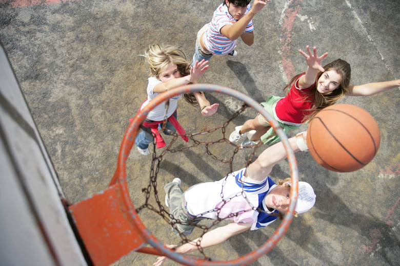 Young people playing basketball