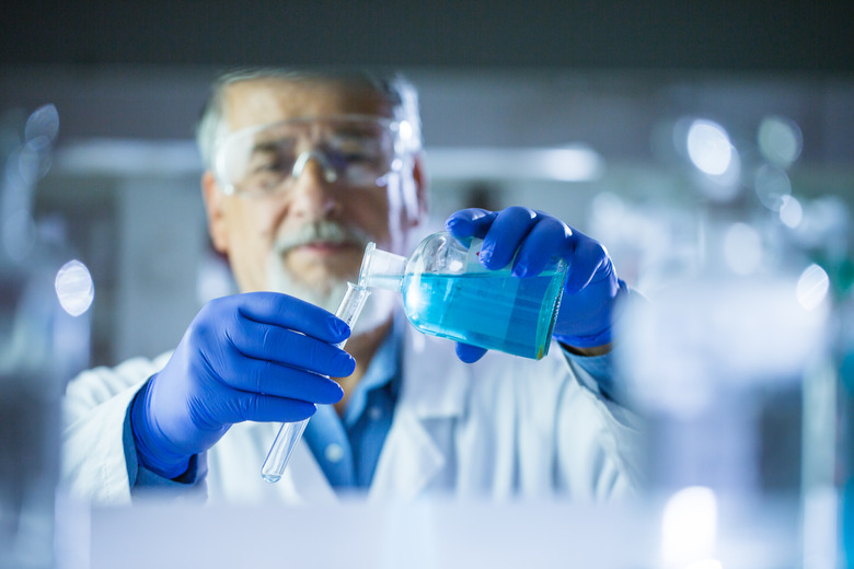 Senior male researcher carrying out scientific research in a lab