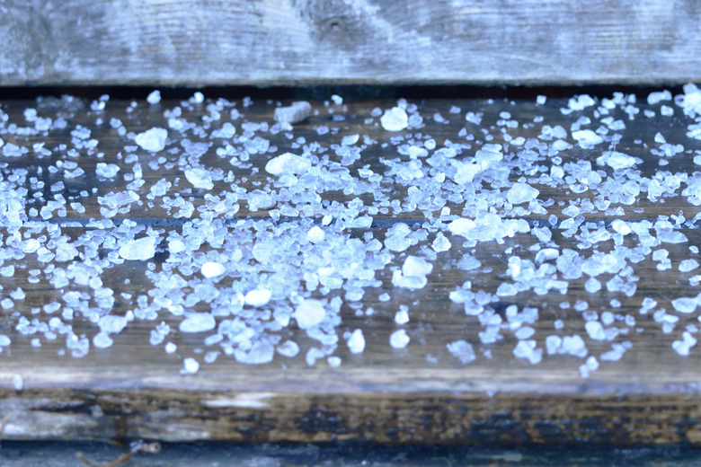 Road Rock Salt on Wooden Stair Step Close Up Abstract