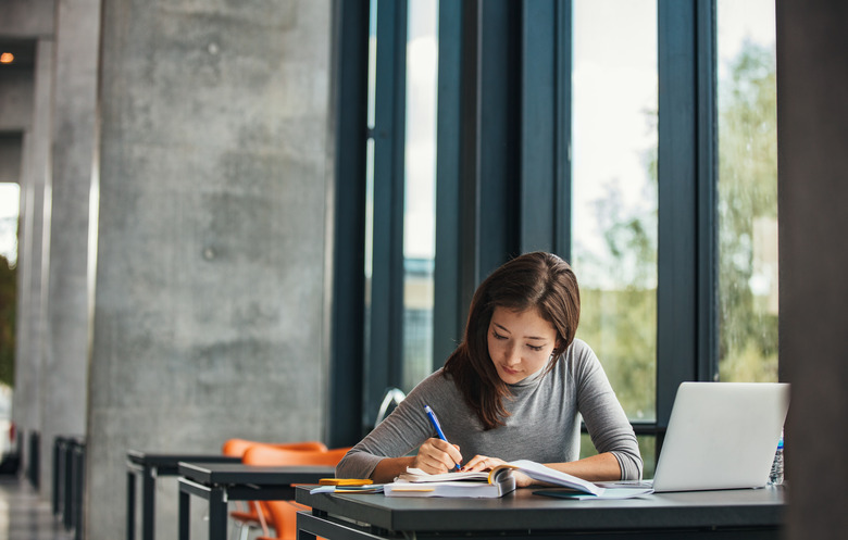 Asian student studying in library