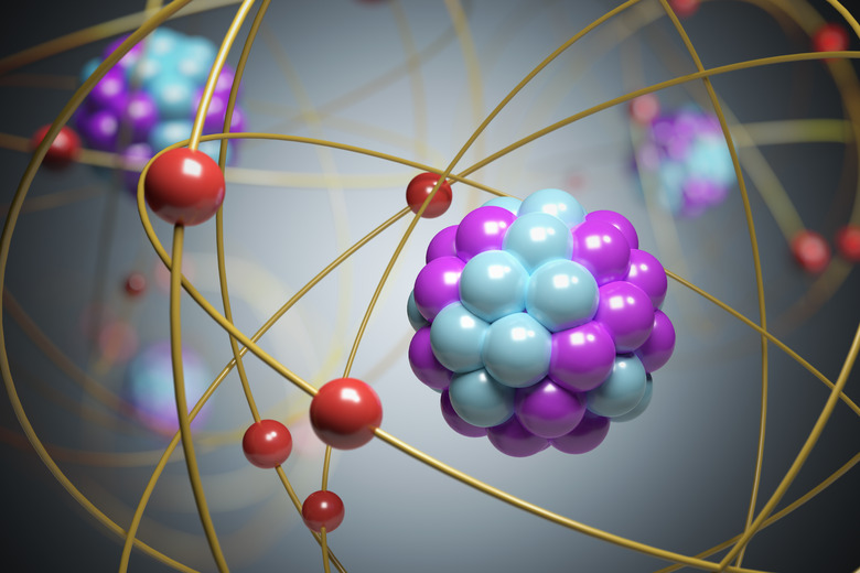 3D rendered illustration of elementary particles in atom. Physics concept.