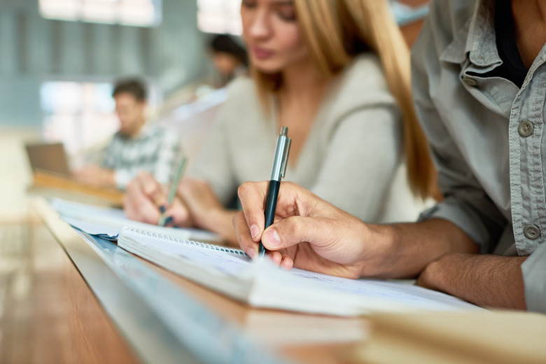 A group of people studying or taking a test