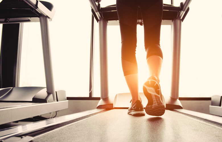 Low Section Of Woman Exercising On Treadmill