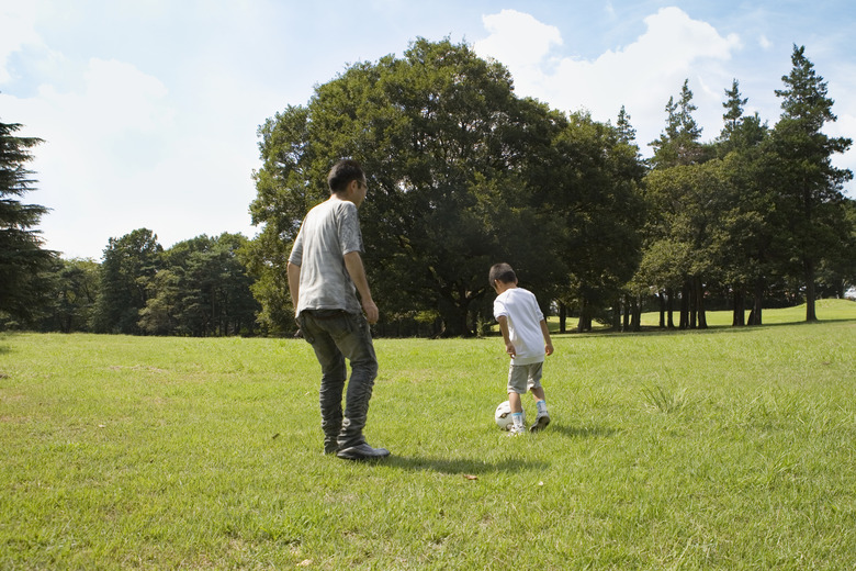 Father and Son Playing Football