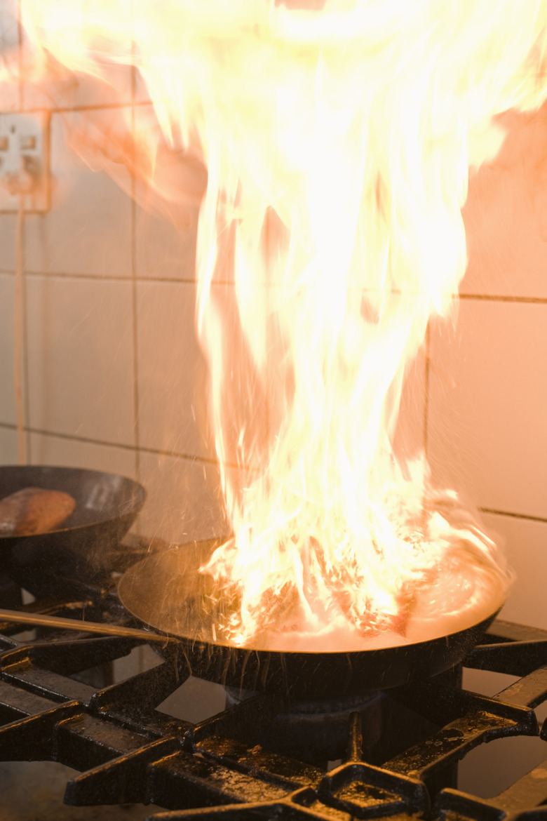 Flaming sauce pan on stove