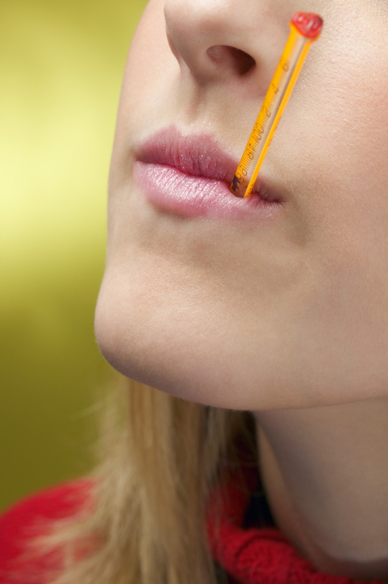 Woman with a thermometer in her mouth