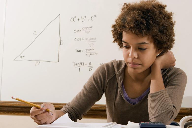 Student thinking and holding a pencil