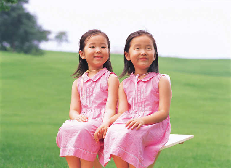 Twin girls dressed in pink