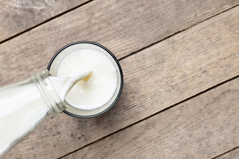 milk pouring into glass