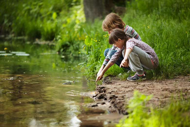 Boy with a girl near the water