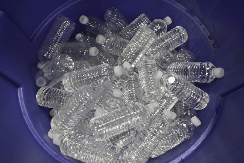 Bottles of water in a bucket, view from above