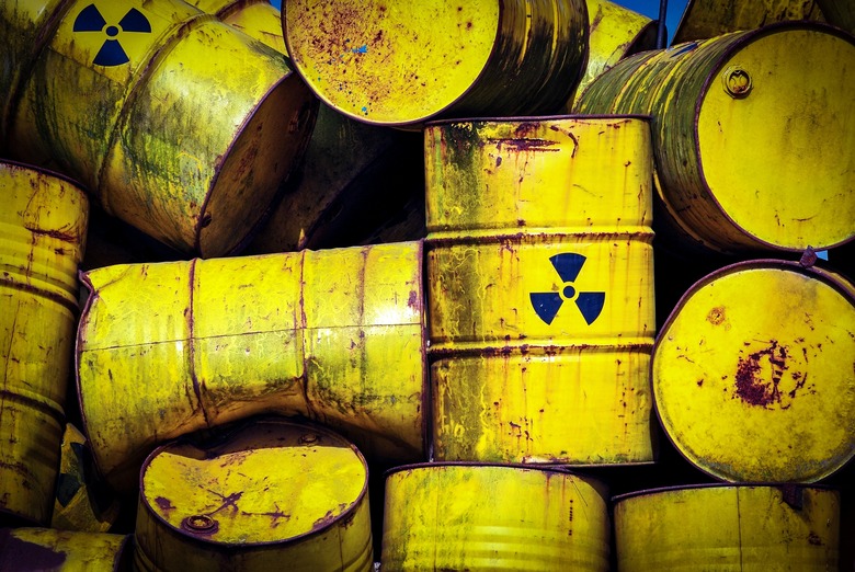 Full Frame Shot Of Abandoned Drums With Radioactive Warning Symbol