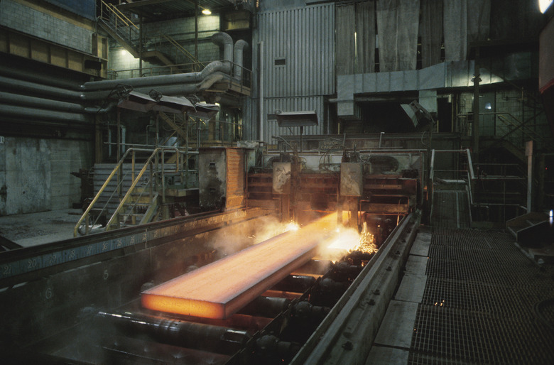 Melting steel on conveyor belt in factory