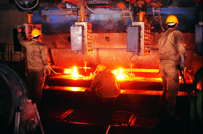 Foundry workers near red-hot steel