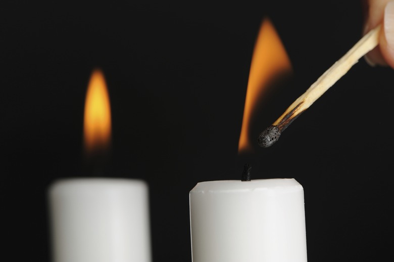 Candle Being Lit with Match