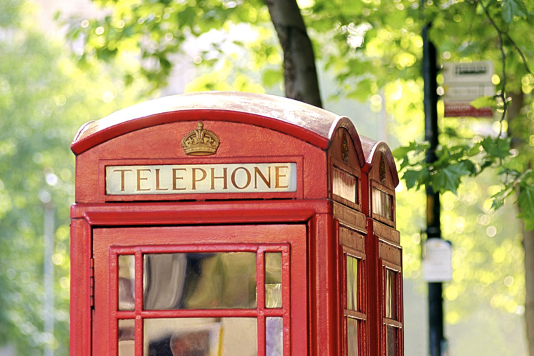 Close-up of the top of a red telephone booth in London, England.