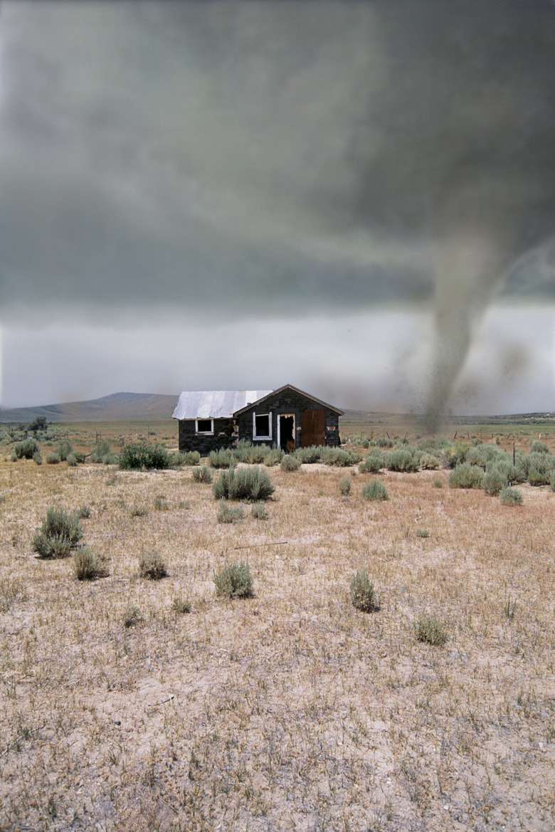 Tornado near house in desert